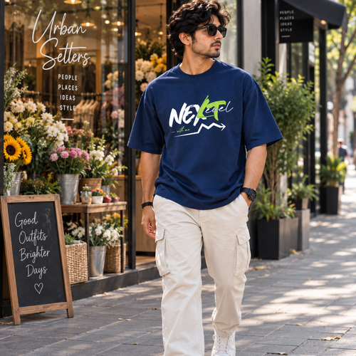Next Level Oversized T-Shirt Navy Blue – Side view on blue background